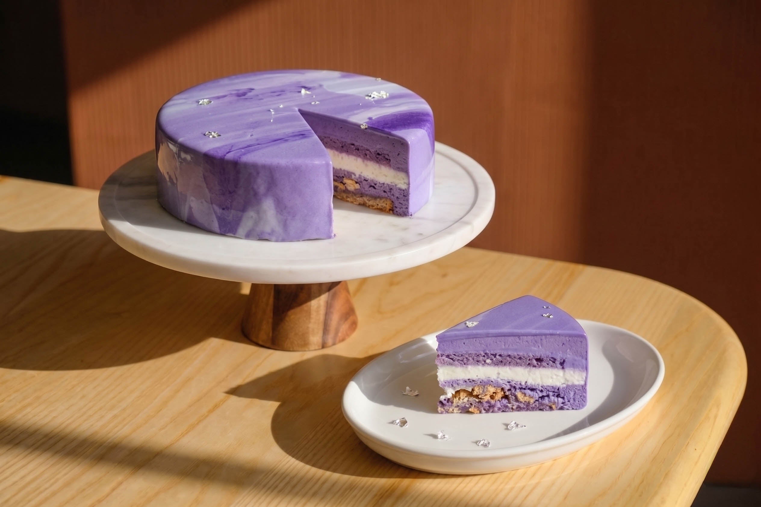 8 inch ube coconut mousse cake in purple with coconut cream layers from Blue Moon Bakehouse