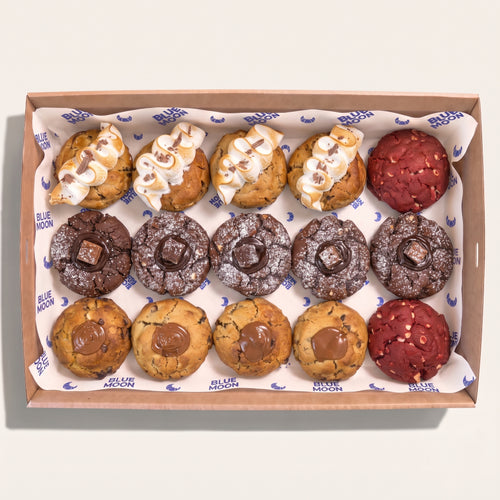 Box of assorted cookies including Red Velvet Chocolate Smores Salted Caramel and Matcha from Blue Moon Bakehouse