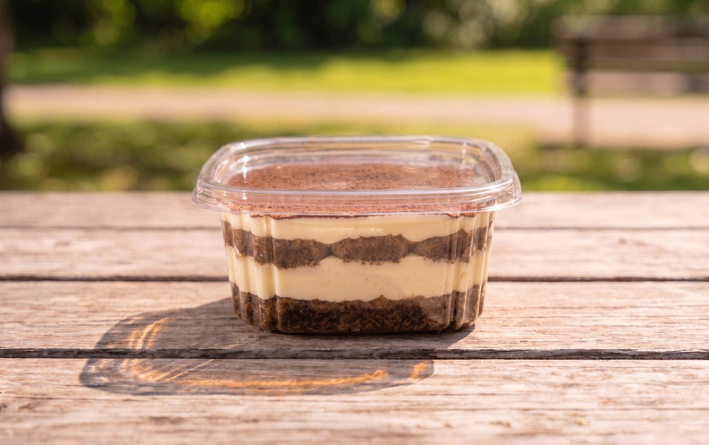 mascarpone cream over espresso-dipped savoiardi, dusted with cocoa
