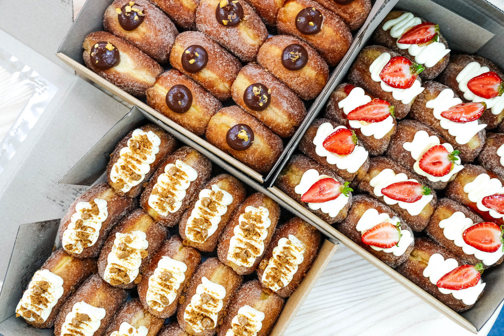 Choose 5 artisan donuts made fresh in-house: Mocha, Pistachio, Salted Caramel, Lemon Meringue, Matcha Strawberry & more. 24hr pre-order.