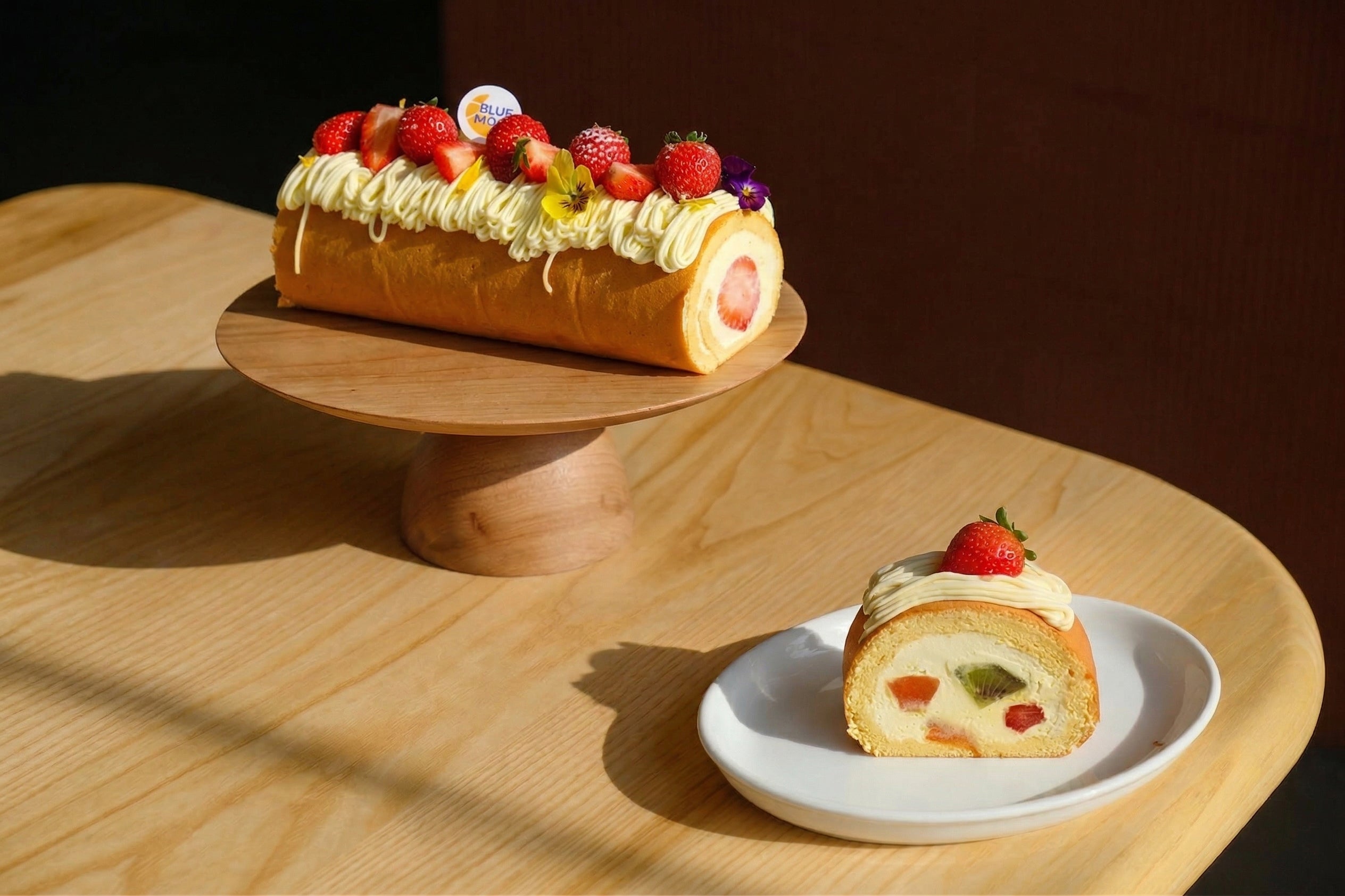 Light souffle roll with seasonal fruit and vanilla cream. Made fresh to order, 48hr notice. Nut-free. Blue Moon Bakehouse, Christchurch.