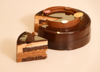 Three layers of chocolate mousse — dark, milk and white — in one decadent 8" cake. 48hr pre-order. Blue Moon Bakehouse Christchurch delivery.