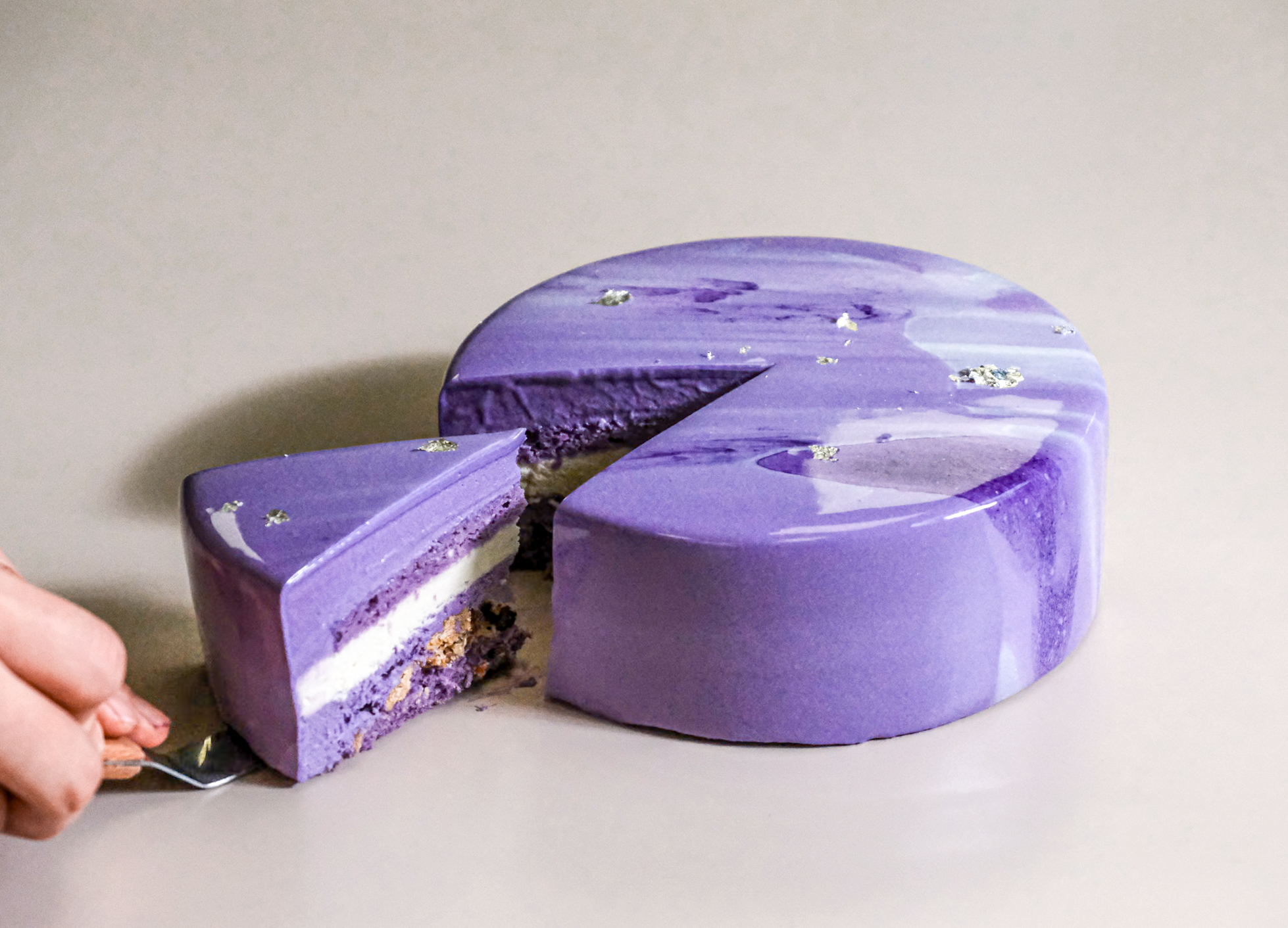 Purple ube mousse layered with coconut cream — light, tropical, stunning. 8" cake, 48hr pre-order. Blue Moon Bakehouse Christchurch delivery.