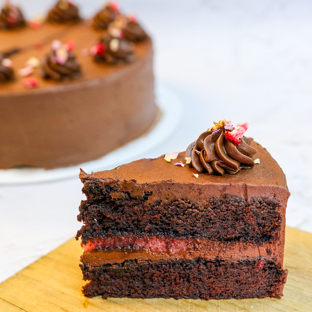 Rich, fudgy vegan chocolate cake — no dairy, no eggs, all flavour. 8" cake, 48hr pre-order. Christchurch pickup & delivery.