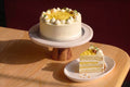 Lemon yuzu chiffon cake from Blue Moon Bakehouse, light sponge layered with yuzu cream and lemon curd, smooth cream finish, 8-inch whole cake