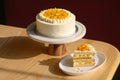 Light sponge layered with mango and whipped cream — a tropical 8" celebration cake. 48hr pre-order. Christchurch pickup & delivery.