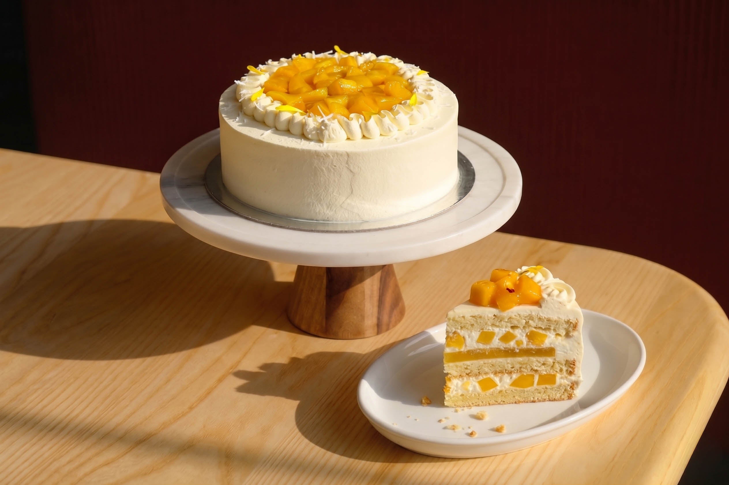 Light sponge layered with mango and whipped cream — a tropical 8" celebration cake. 48hr pre-order. Christchurch pickup & delivery.