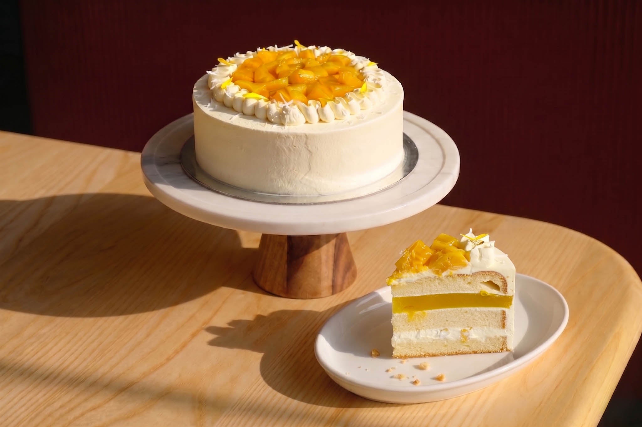 Light sponge layered with mango and whipped cream — a tropical 8" celebration cake. 48hr pre-order. Christchurch pickup & delivery.